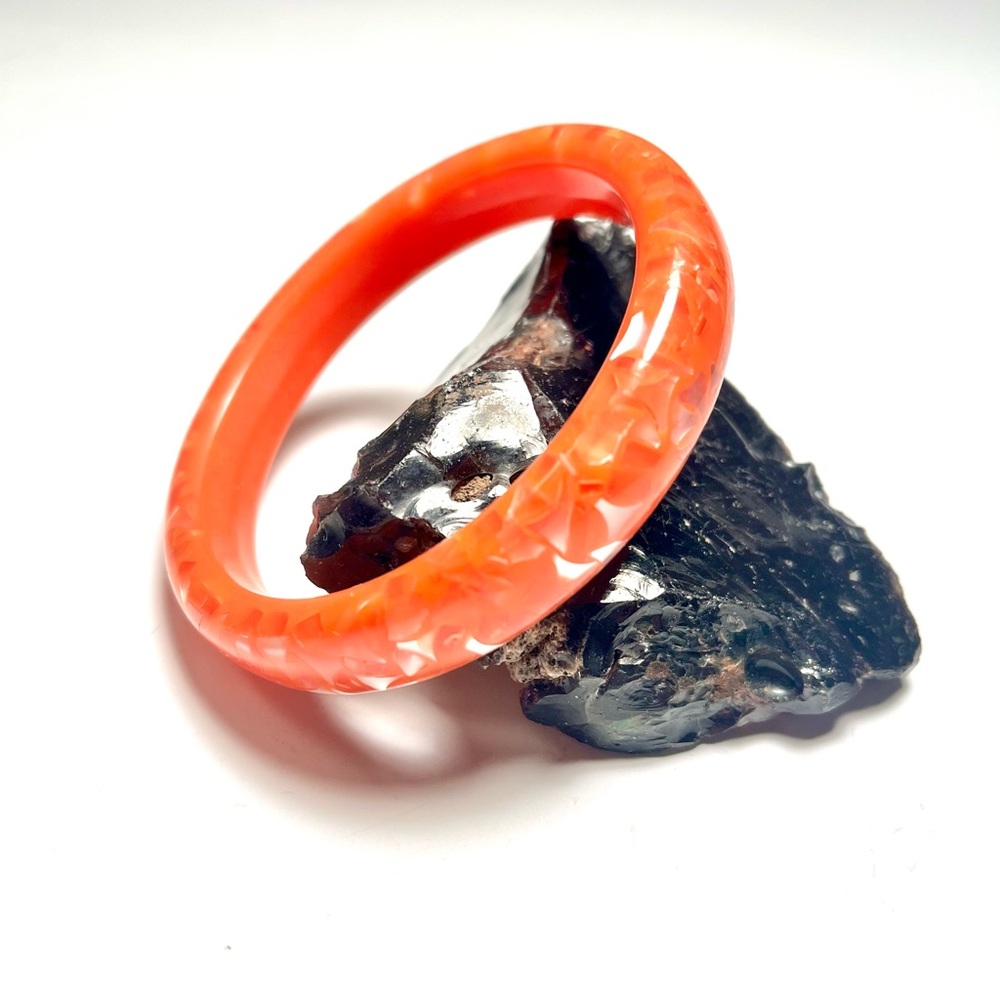 Orange Resin Bangle Bracelet with Translucent/Silver-like Flecks inside.